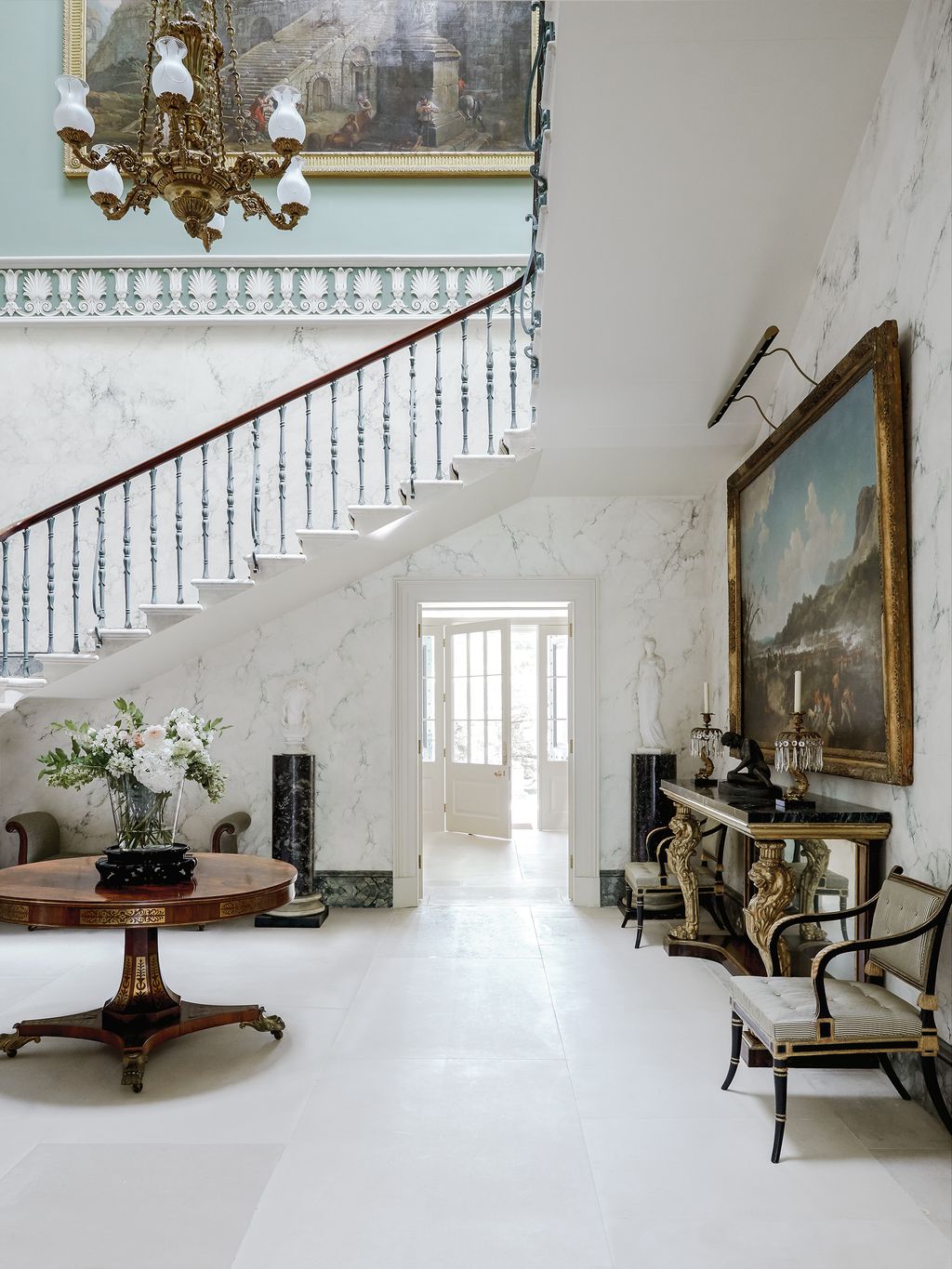 Image may contain Interior Design Indoors Living Room Room Flooring Furniture Table Chair Wood and Housing