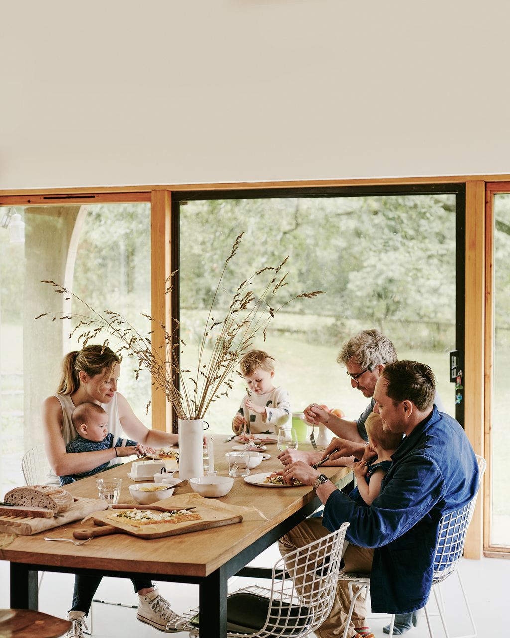 Image may contain Human Person Furniture Dining Table Table Restaurant Wood and Tabletop