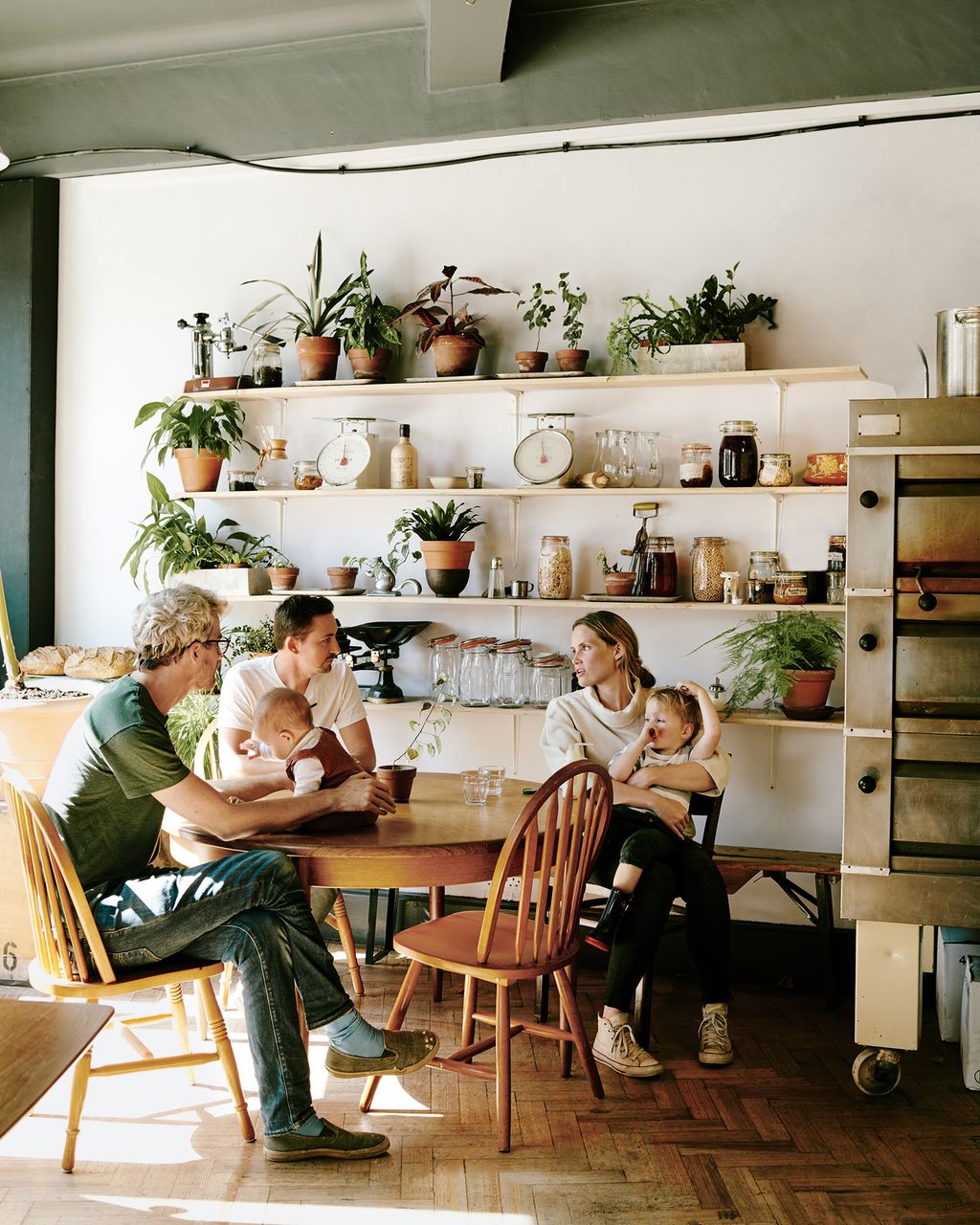 Image may contain Furniture Chair Human Person Restaurant Footwear Clothing Shoe Apparel Cafeteria Cafe and Shelf