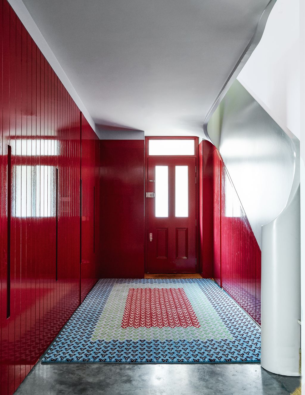 Image may contain Flooring Floor Corridor Door Interior Design Indoors Rug Lighting Housing and Building