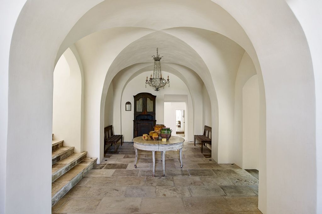 A plasterboard ceiling was removed to reveal the hall's original arches.