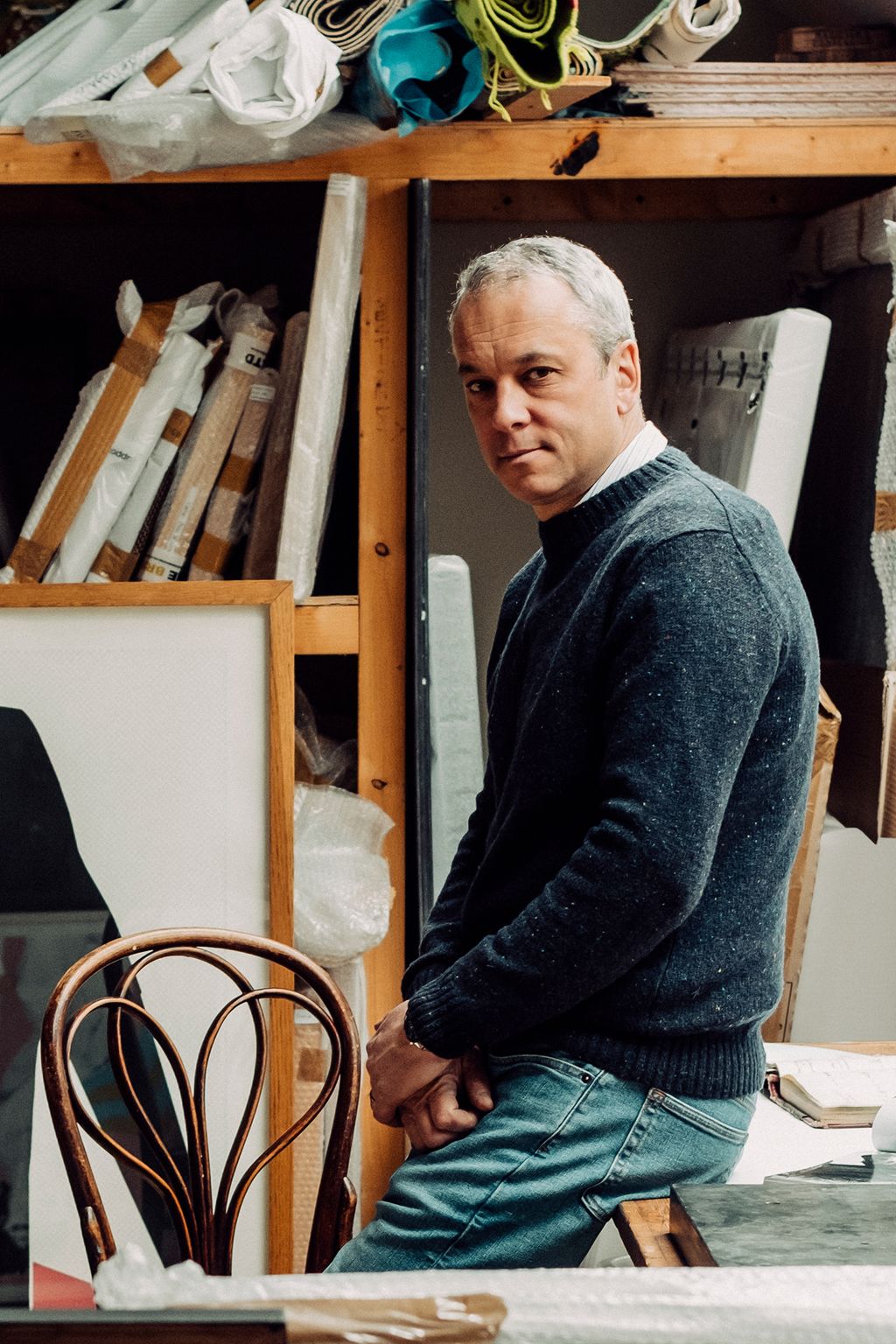 Image may contain Wood Plywood Clothing Apparel Shelf Human Person Pants Hardwood Banister and Handrail