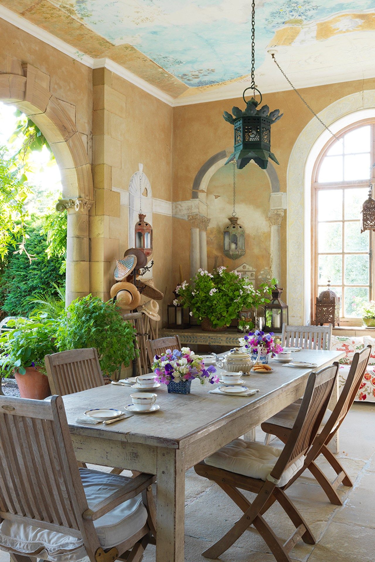 Image may contain Furniture Chair Dining Table Table Room Indoors Wood Dining Room and Plant