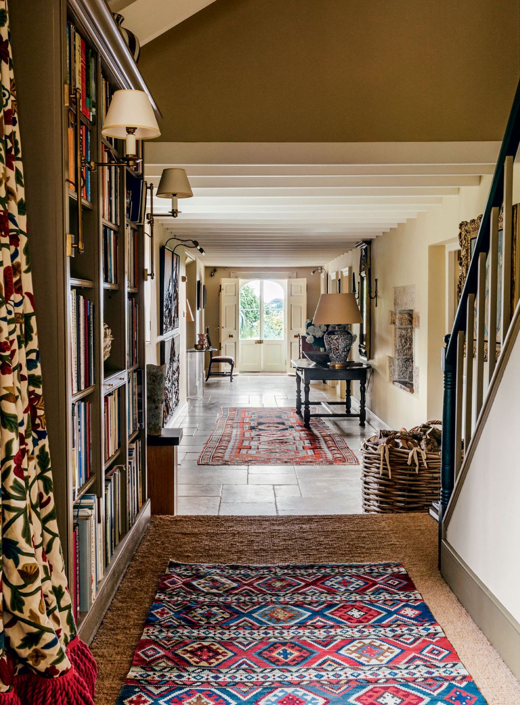 Image may contain Flooring Floor Interior Design Indoors Rug Shelf Wood Corridor Banister Handrail and Hardwood