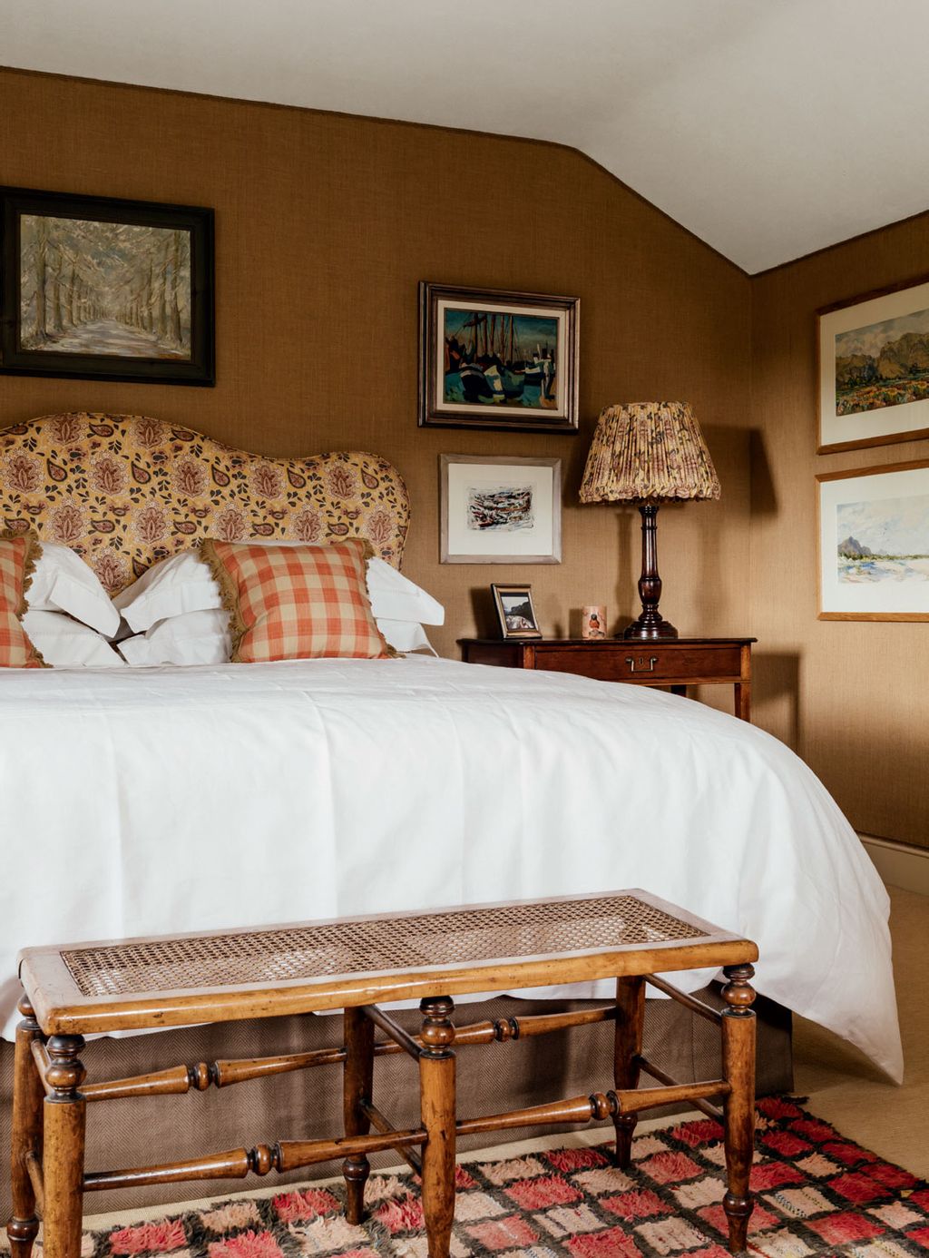 Image may contain Furniture Indoors Room Bedroom Bed Interior Design Wood Lamp and Table Lamp