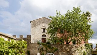 Image may contain Plant Tree Outdoors Car Vehicle Transportation Automobile Vegetation Bush Path and Walkway