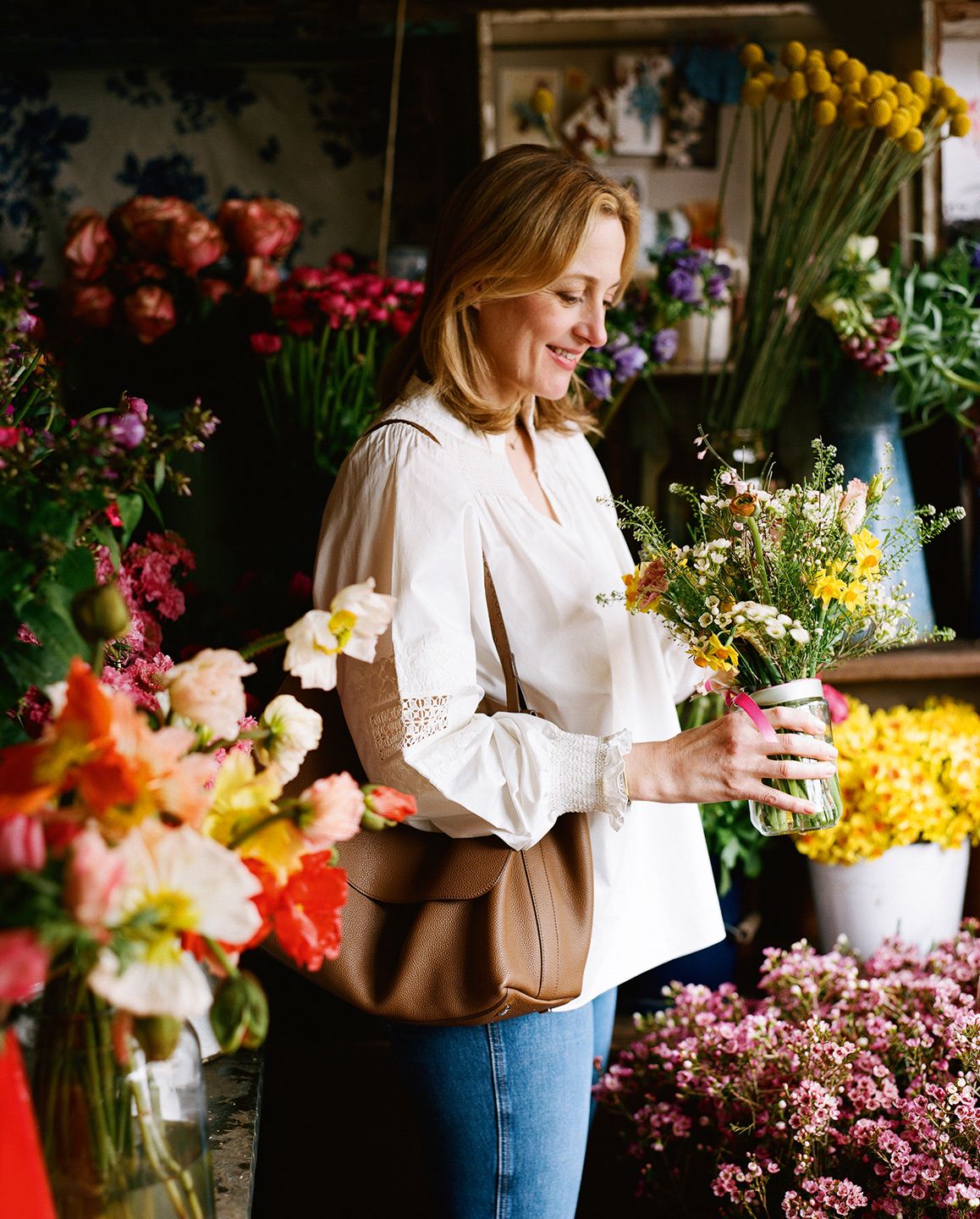 Image may contain Plant Flower Blossom Human Person Flower Bouquet and Flower Arrangement