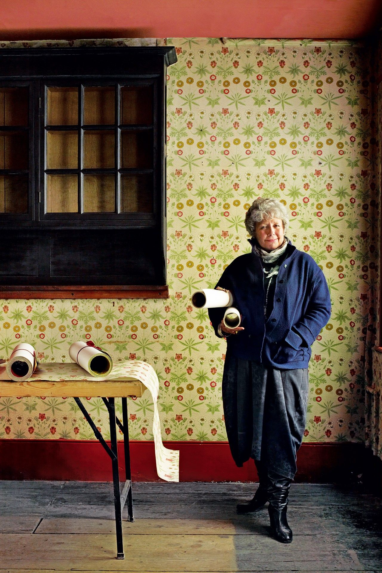 Image may contain Furniture Home Decor Human Person Wood Clothing and Apparel