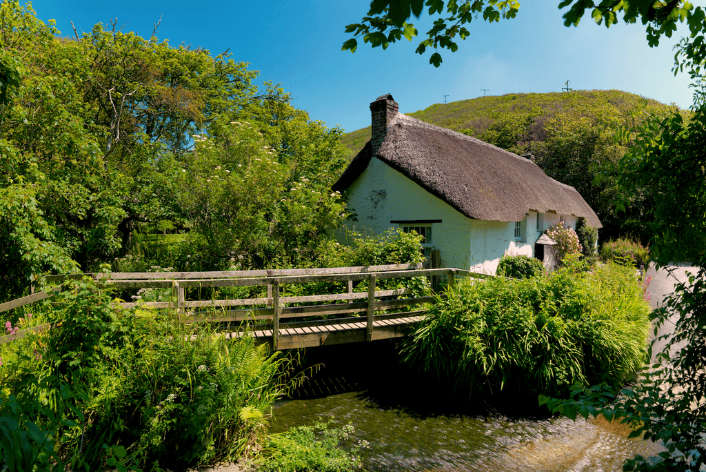 Image may contain Nature Outdoors Building Cottage Housing House Countryside Water Hut and Rural