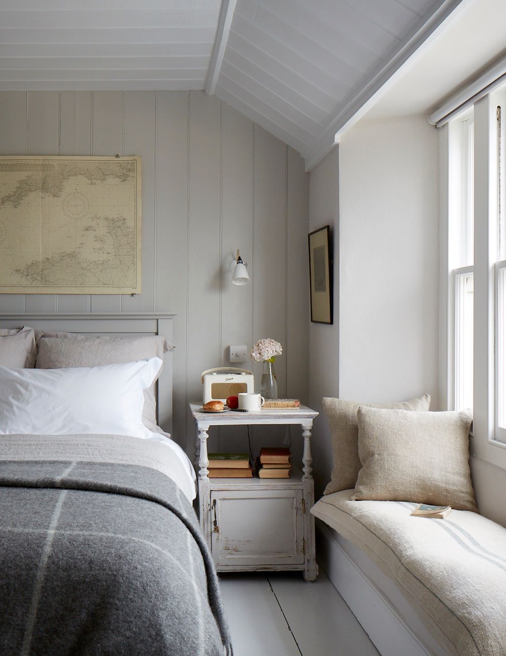 Image may contain Indoors Room Bedroom Furniture Living Room Interior Design Bed and Dorm Room