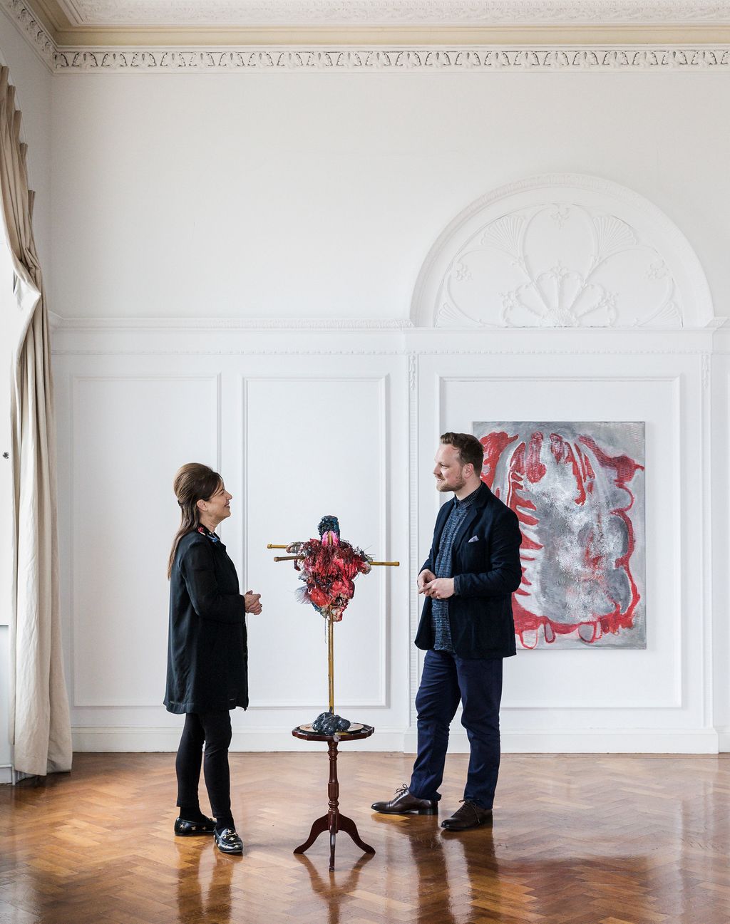 Image may contain Flooring Human Person Clothing Apparel Footwear Shoe Floor Suit Coat Overcoat and Art