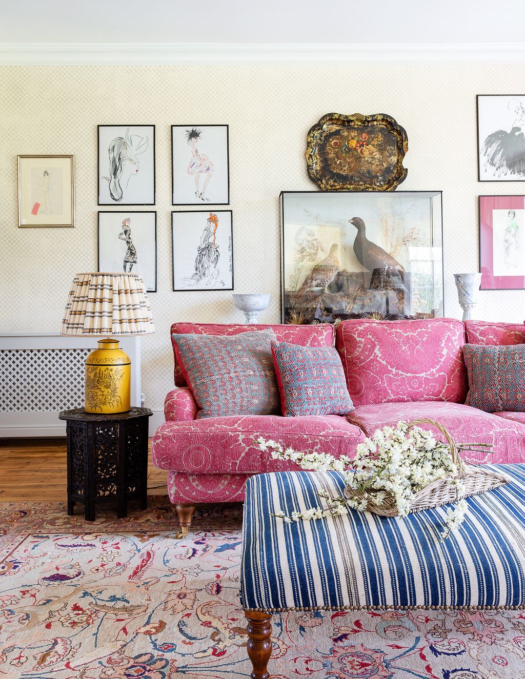 Image may contain Furniture Couch Living Room Indoors Room Animal Bird Table Cushion and Rug