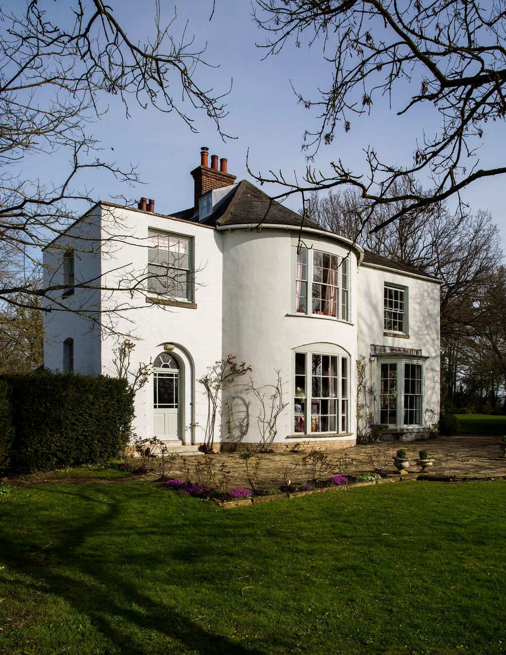 Image may contain Plant Grass Lawn Building Housing House and Mansion
