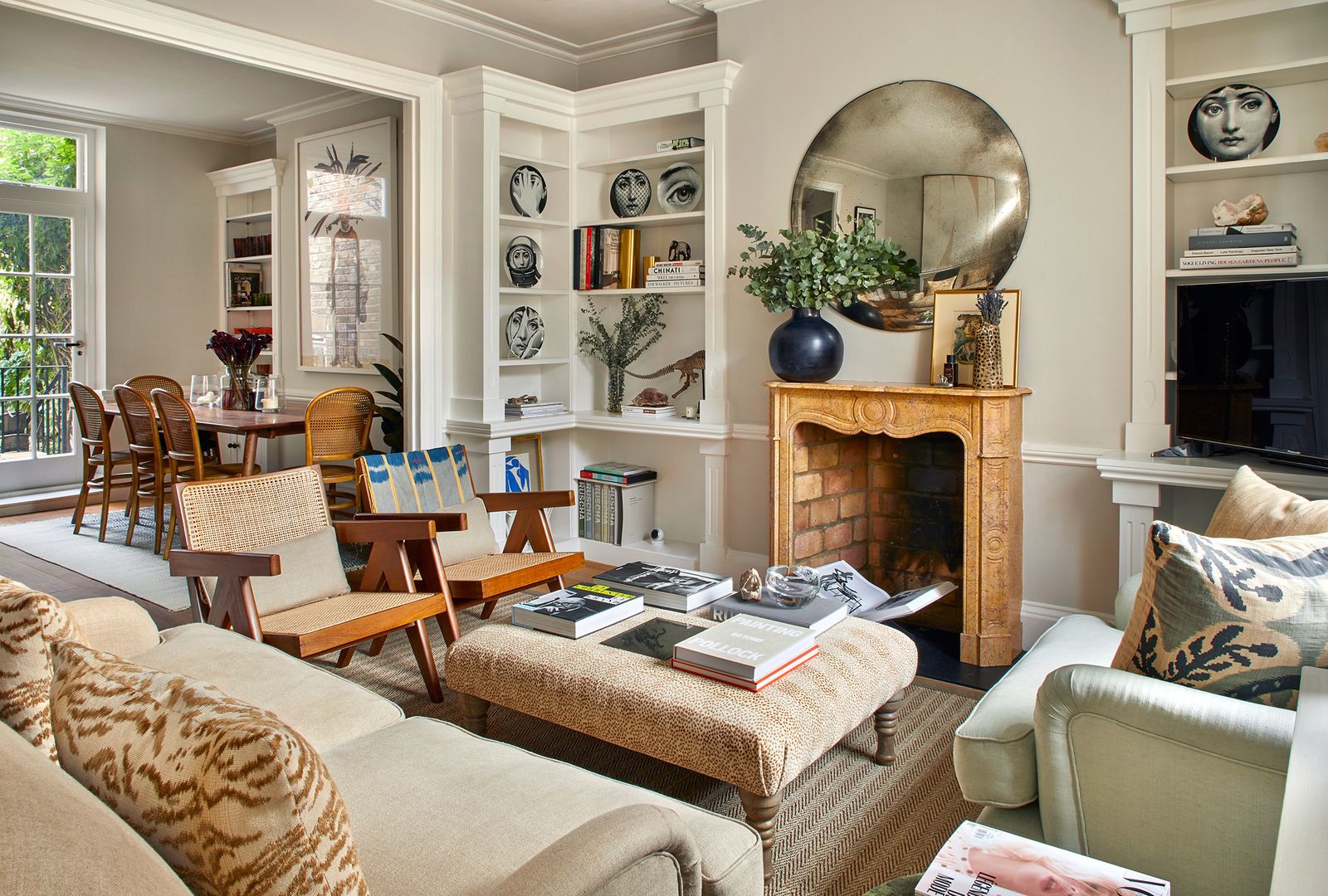 Image may contain Furniture Living Room Room Indoors Chair Table Rug Interior Design and Couch