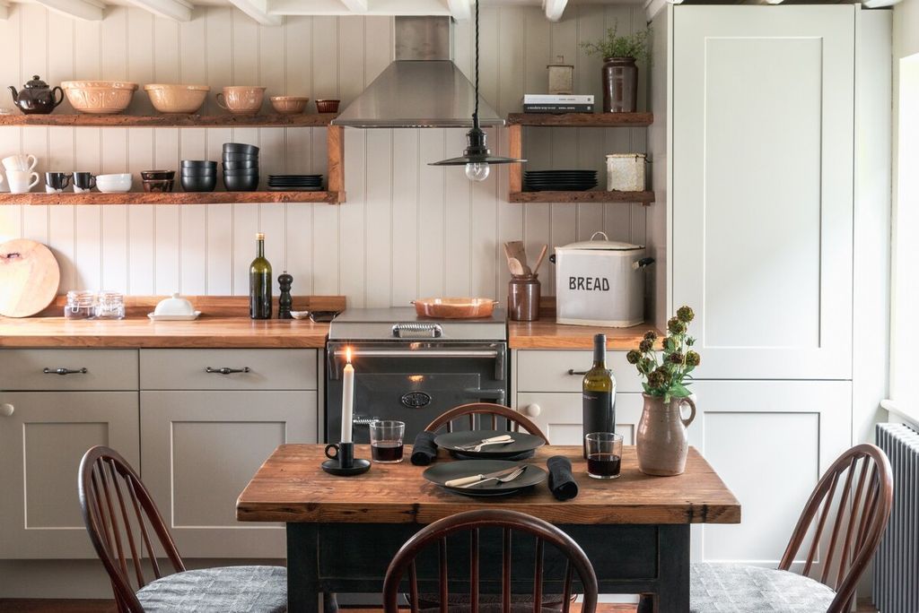 Image may contain Furniture Chair Indoors Room Wood Table Kitchen and Kitchen Island