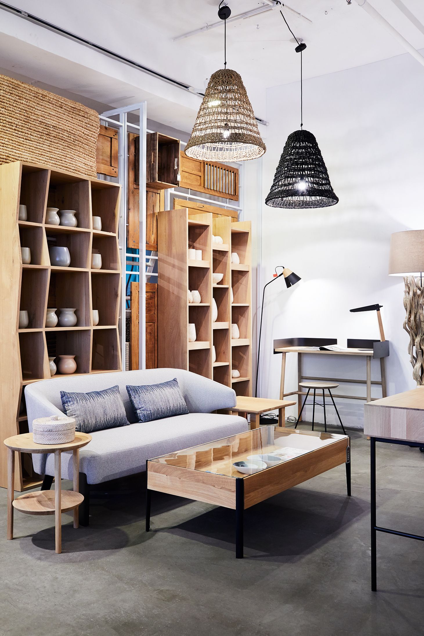 Image may contain Furniture Indoors Room Living Room Wood Table Rug and Shelf