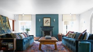 Image may contain Living Room Room Indoors Furniture Couch Rug Flooring and Interior Design