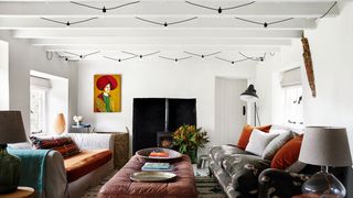 Image may contain Living Room Room Indoors Furniture Couch Interior Design Rug and Table