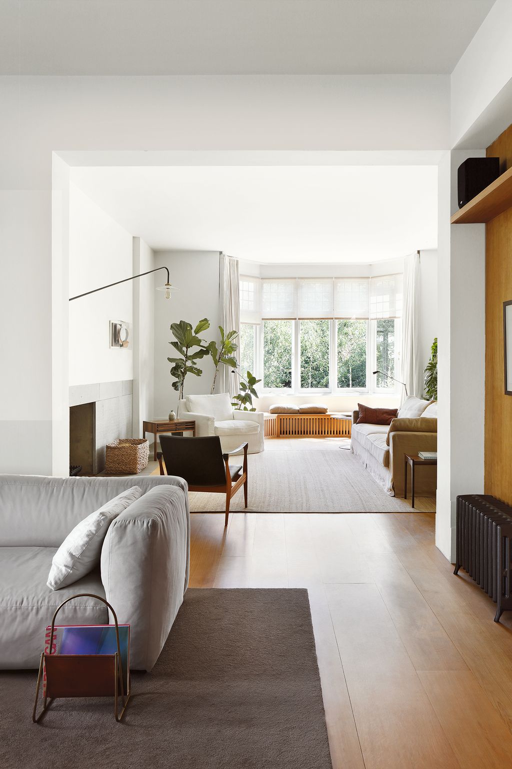 On the ground floor the library area with a sofa from Cassina leads through to the main seating area.
