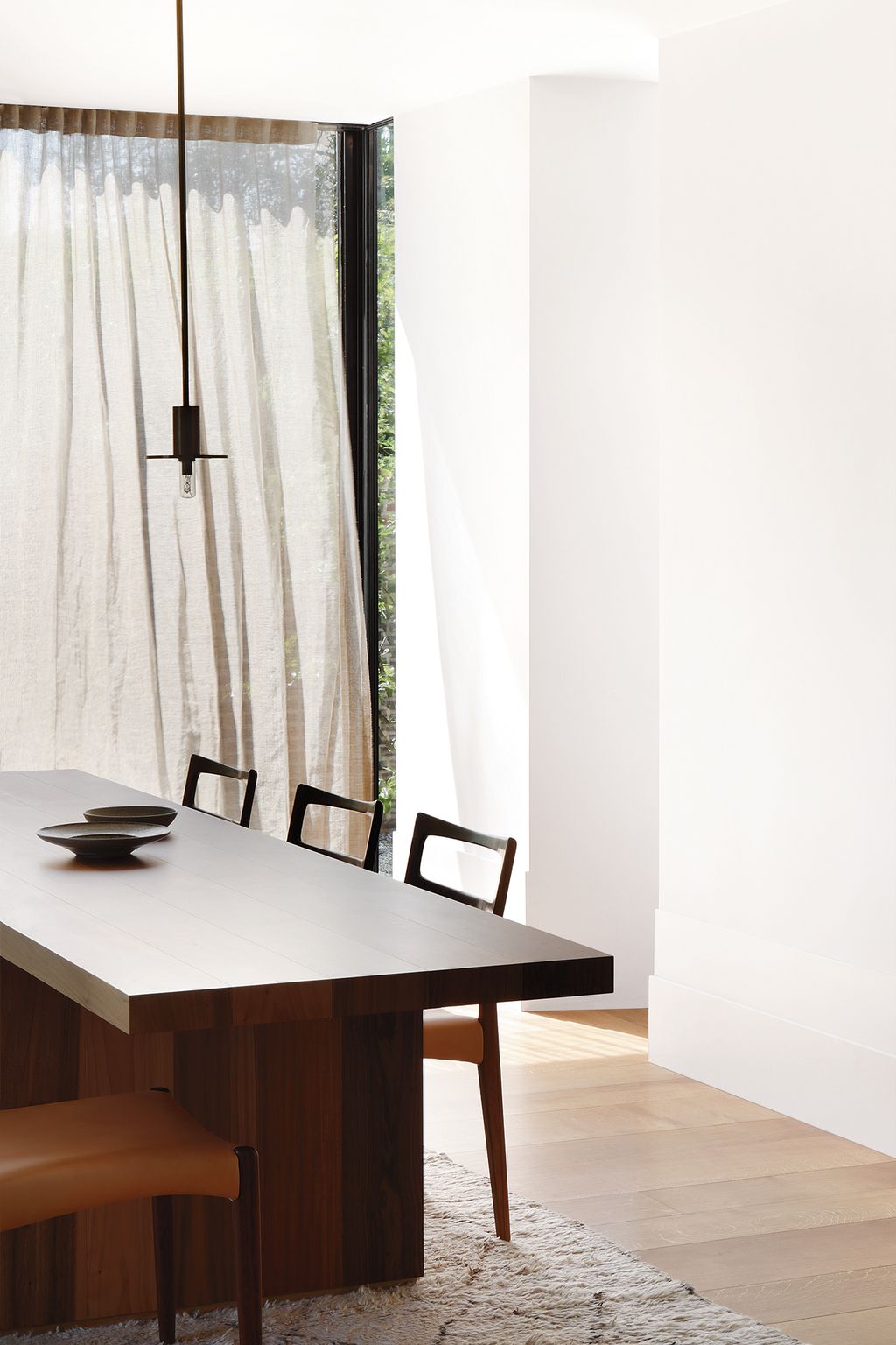 Image may contain Furniture Tabletop Chair Indoors Room Table Wood and Dining Table