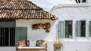 Image may contain Furniture Couch Home Decor Outdoors Nature Building Shelter Countryside Rural and Flagstone