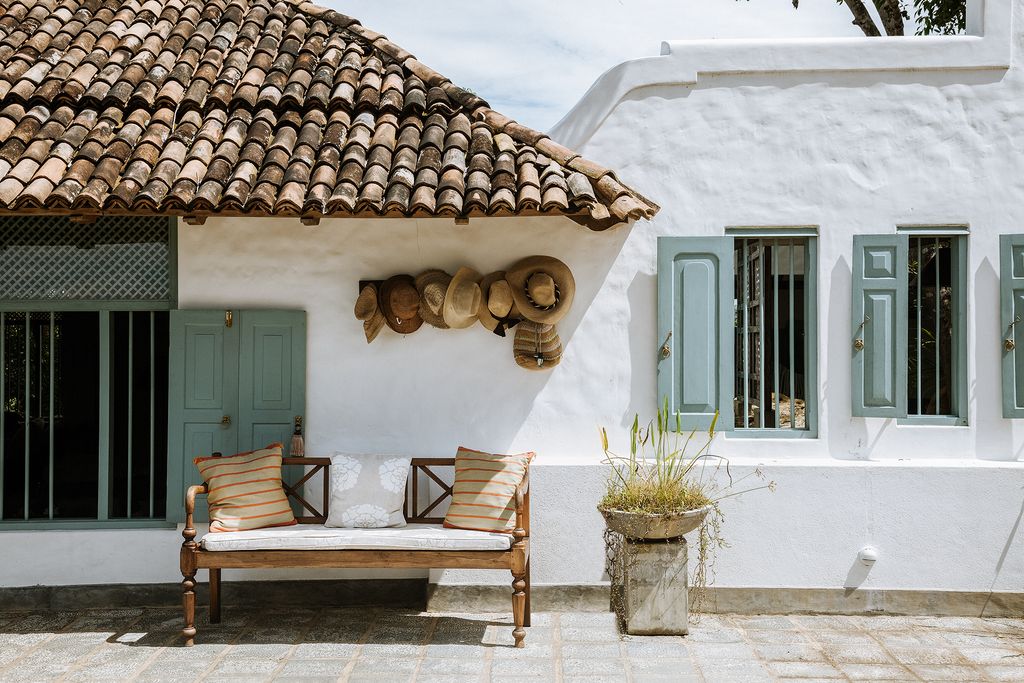 Image may contain Furniture Couch Home Decor Outdoors Nature Building Shelter Countryside Rural and Flagstone