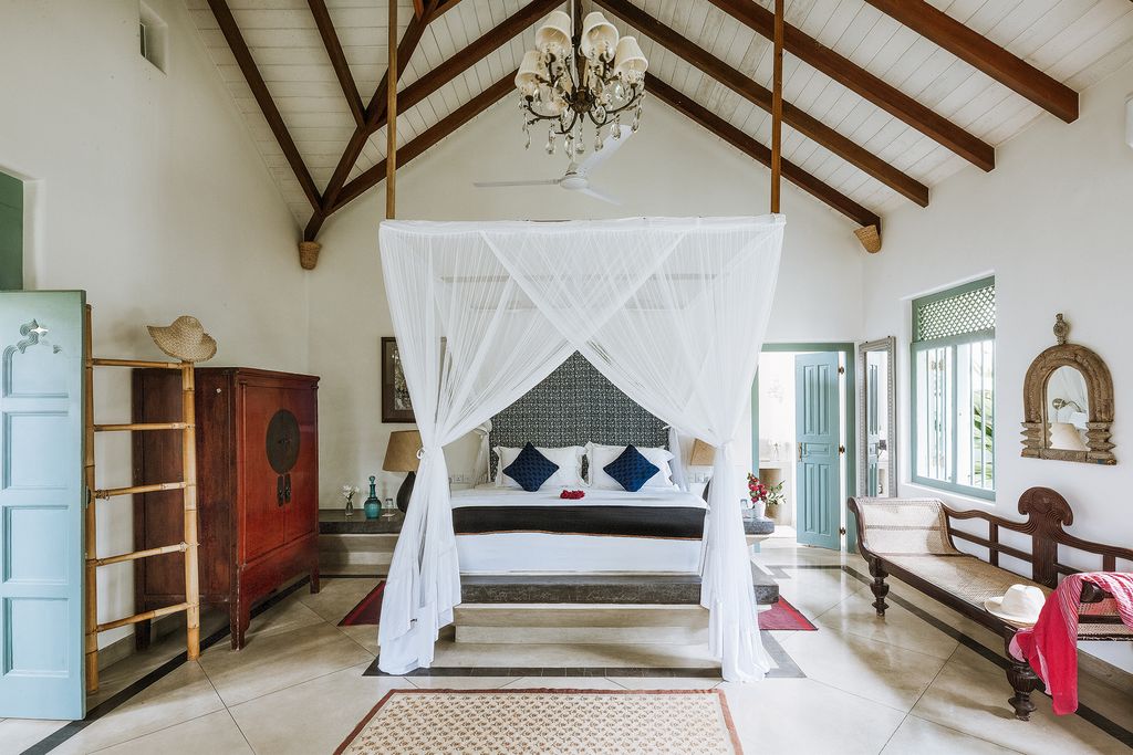 Image may contain Flooring Interior Design Indoors Furniture Wood Hardwood Mosquito Net Room Floor and Living Room