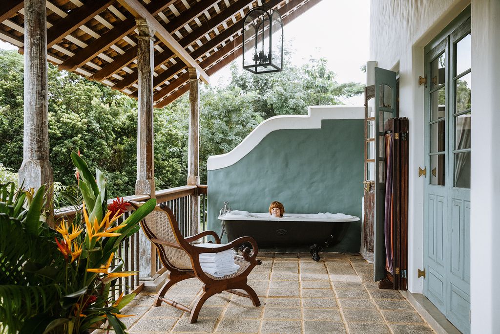 The Thirties bathtubs here and in the bathroom came from the Galle Face Hotel in Colombo.