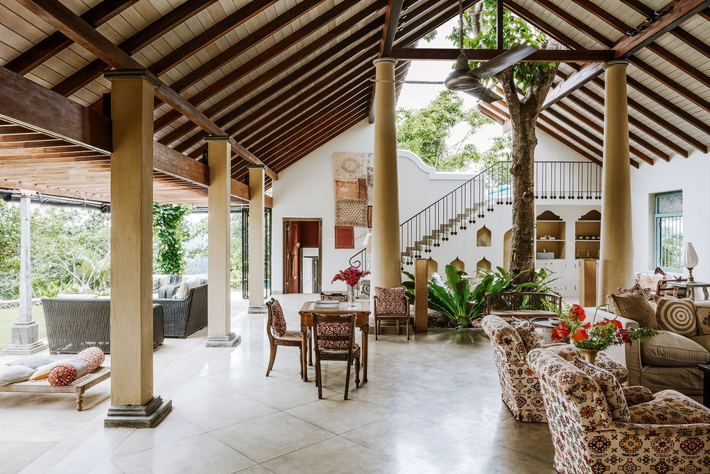 Image may contain Flooring Floor Furniture Chair Indoors Interior Design Corridor Living Room Room and Lobby