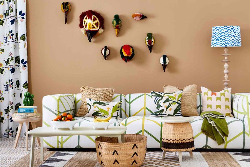 Image may contain Furniture Couch Living Room Indoors Room Cushion Pillow and Table