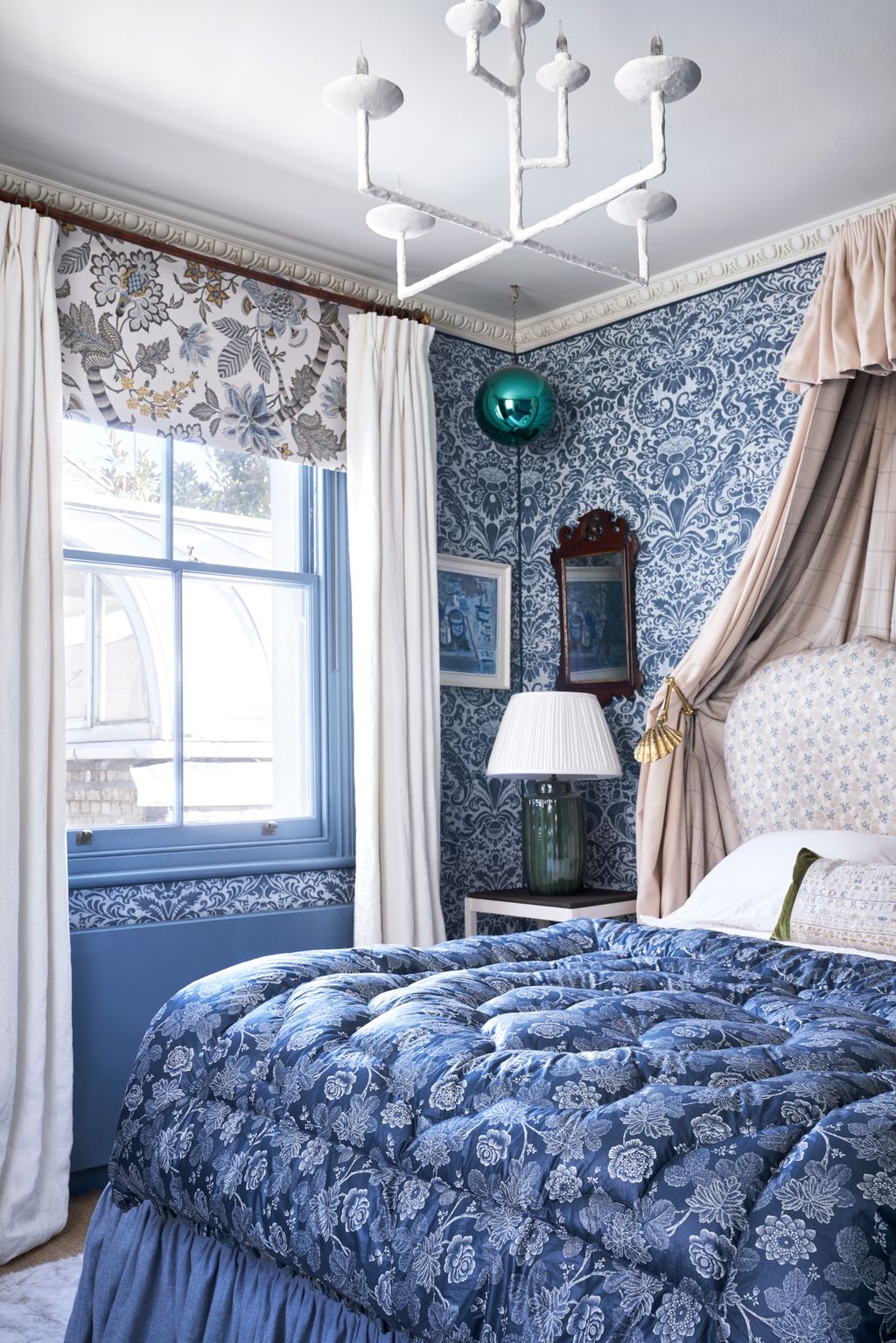 Image may contain Indoors Room Bedroom Furniture Bed Home Decor Lamp Table Lamp and Interior Design