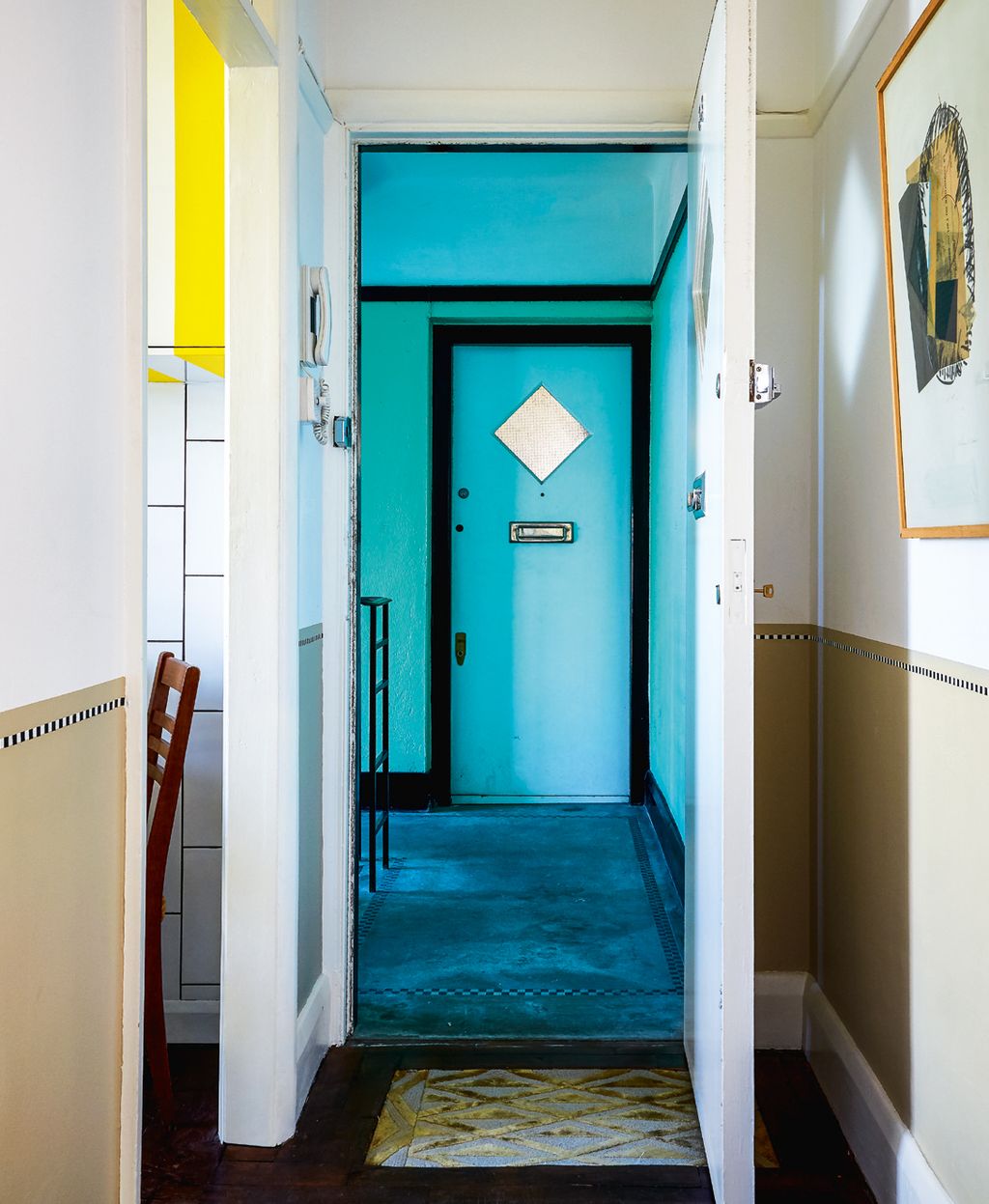 Thomas created the wall frieze using washi tape in the hall.