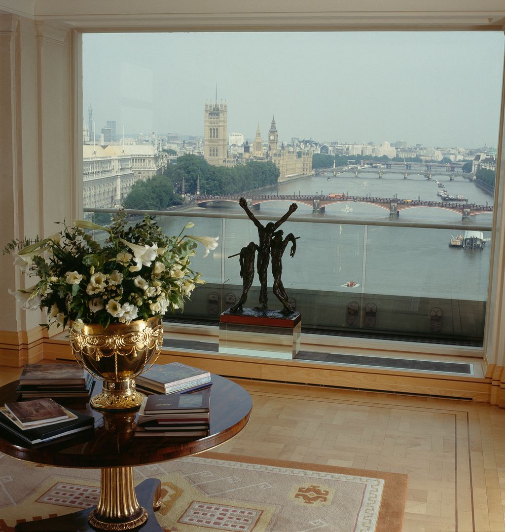 The rosewood table is by William Bedford. Other tables were designed by Pygmalion and made by John Fabrick. The rug is...