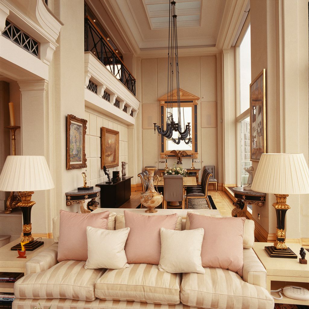 Image may contain Living Room Indoors Room Couch Furniture Lamp and Table Lamp