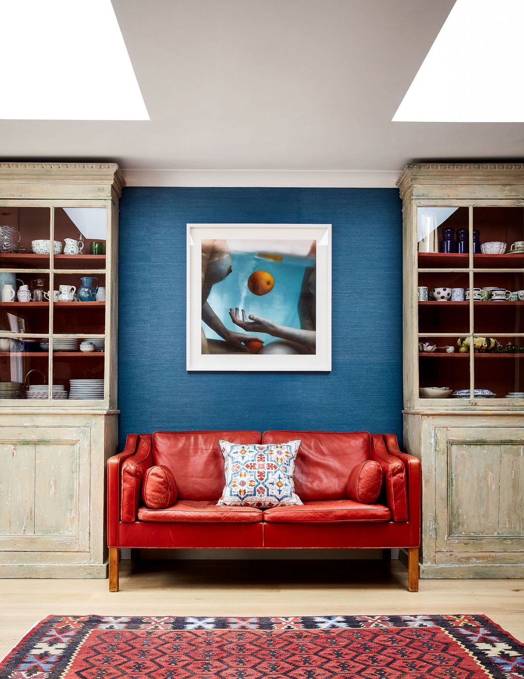 Image may contain Furniture Cupboard Closet Shelf Rug Couch and Cabinet