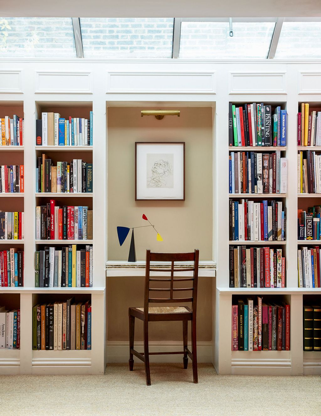 Image may contain Furniture Bookcase Chair Shelf Indoors and Room