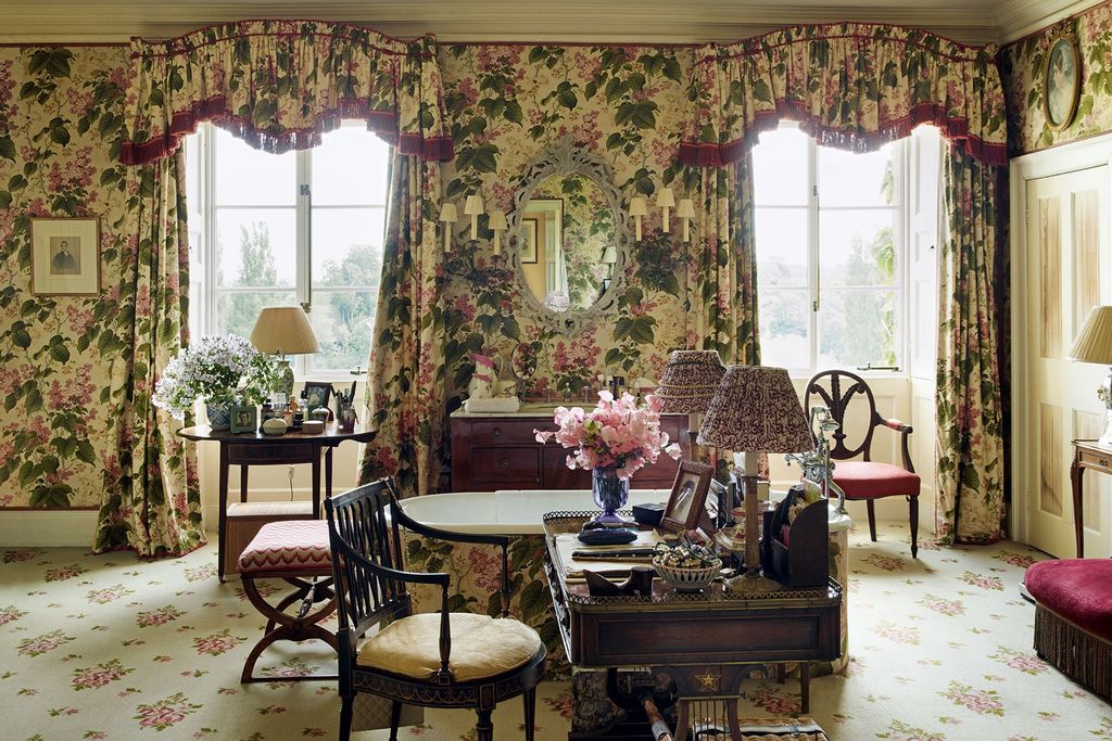 Image may contain Living Room Room Indoors Furniture Chair Interior Design Home Decor Plant Wood and Flower