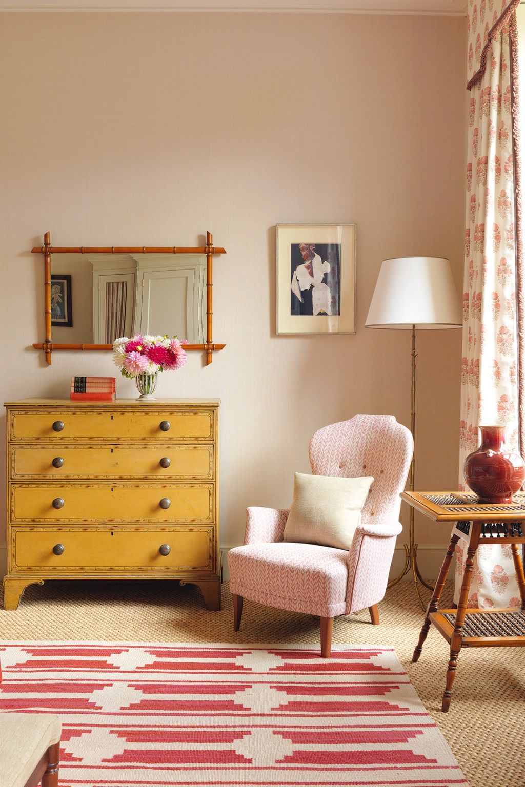 Image may contain Furniture Interior Design Indoors Rug Home Decor Plant Living Room Room Flower Blossom and Chair