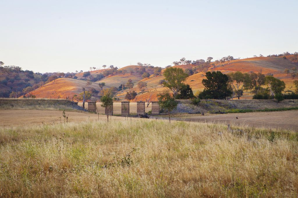 Image may contain Nature Outdoors Grassland Field Countryside Rural Farm Meadow and Building