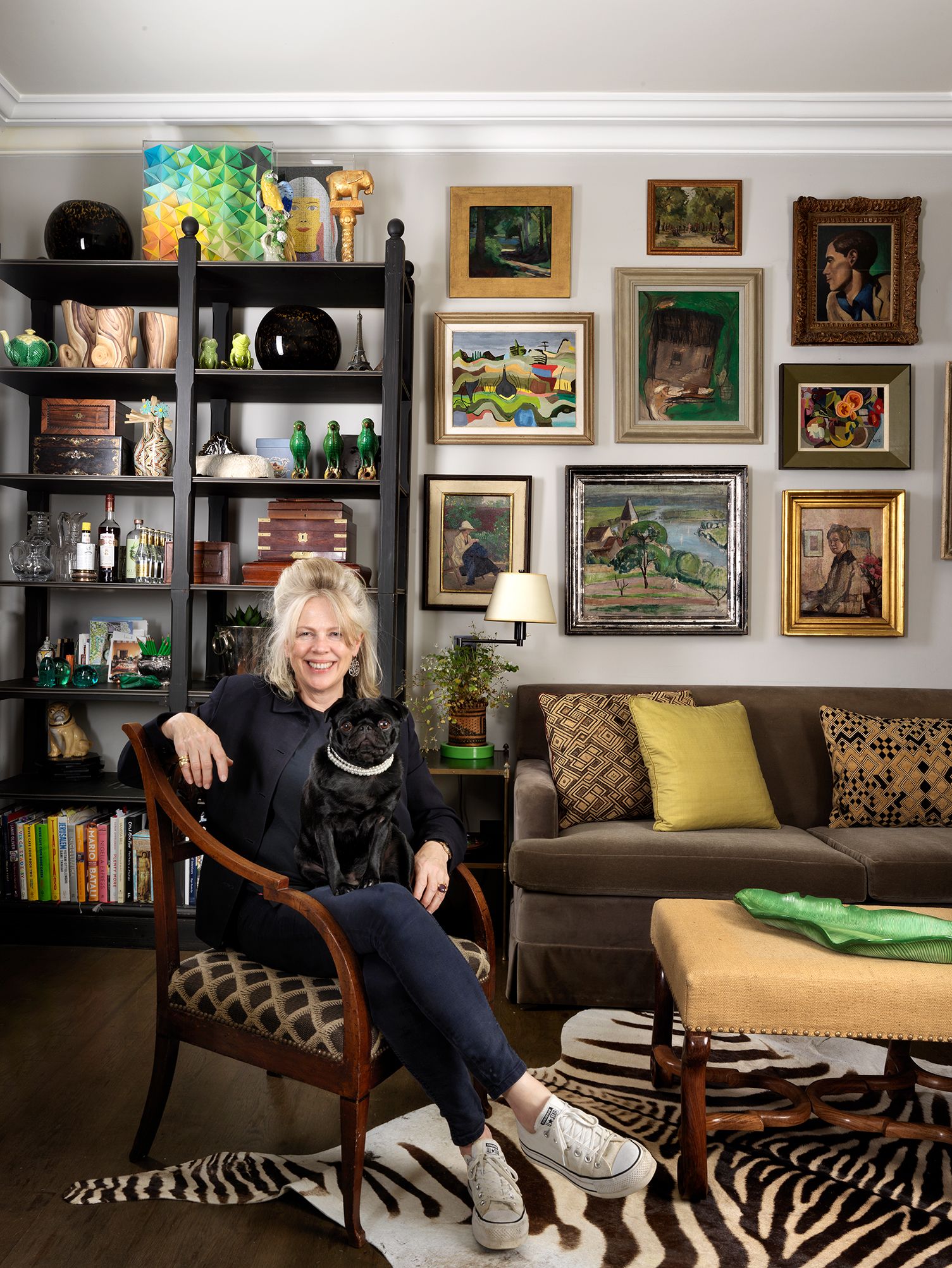 Emma and her pug Dahlia in the sitting room of her former flat in London