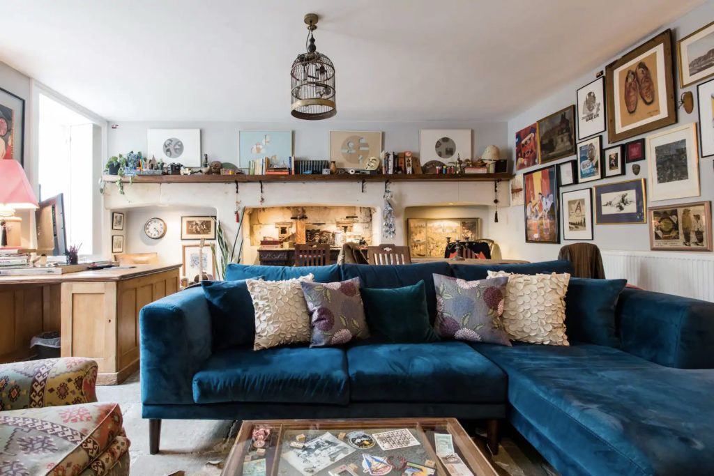 Image may contain Furniture Couch Living Room Room Indoors Cushion and Table