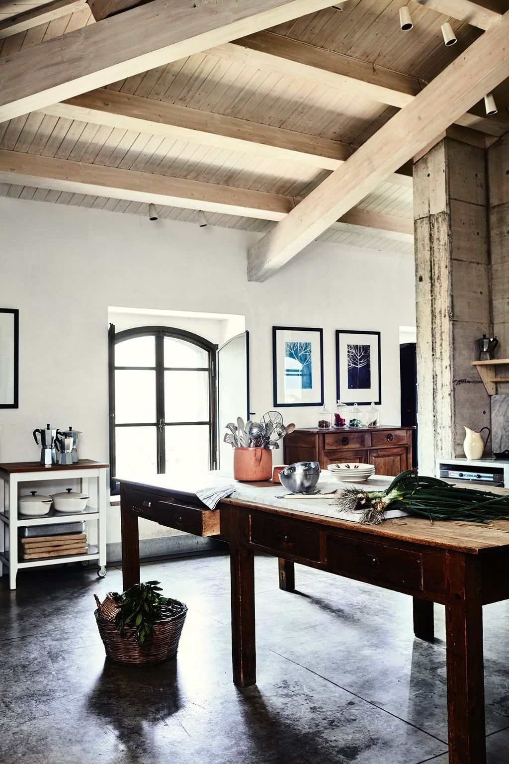 Image may contain Indoors Furniture Housing Building Living Room Room Table Interior Design and Coffee Table