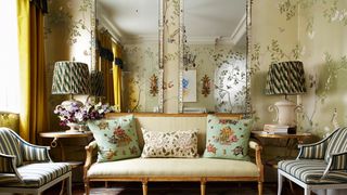 Image may contain Living Room Room Indoors Furniture Couch Lamp Table Lamp Rug Home Decor and Interior Design