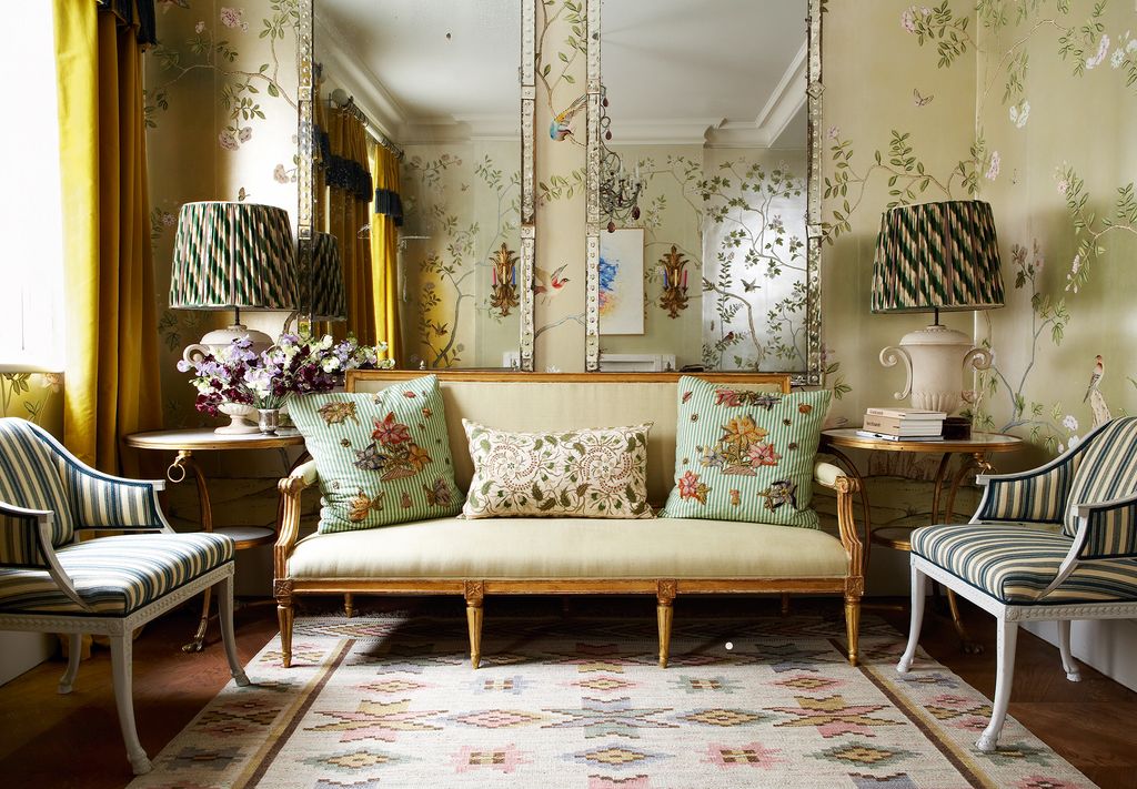 Image may contain Living Room Room Indoors Furniture Couch Lamp Table Lamp Rug Home Decor and Interior Design