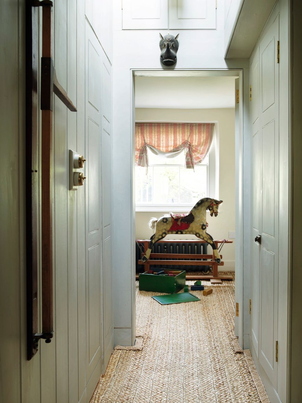 Image may contain Flooring Floor Wood Interior Design Indoors Door Hardwood Furniture Living Room and Room