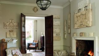 Image may contain Living Room Room Indoors Fireplace Furniture and Interior Design