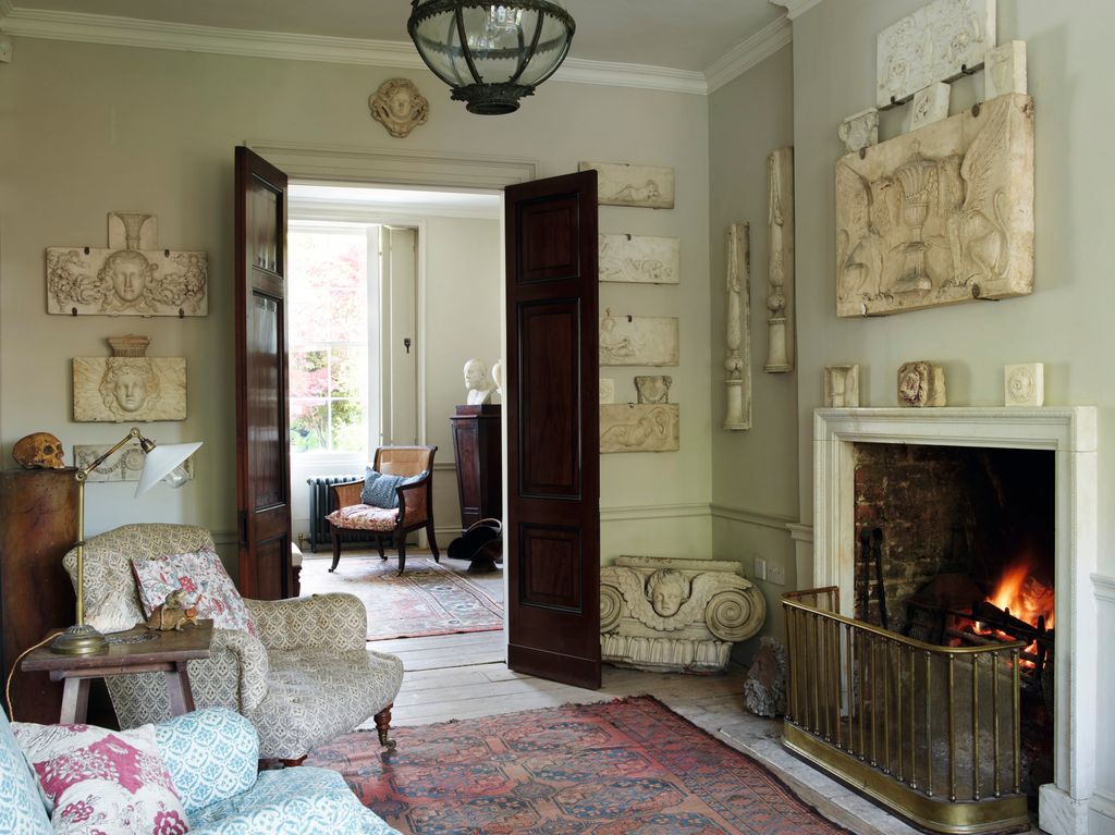 Image may contain Living Room Room Indoors Fireplace Furniture and Interior Design