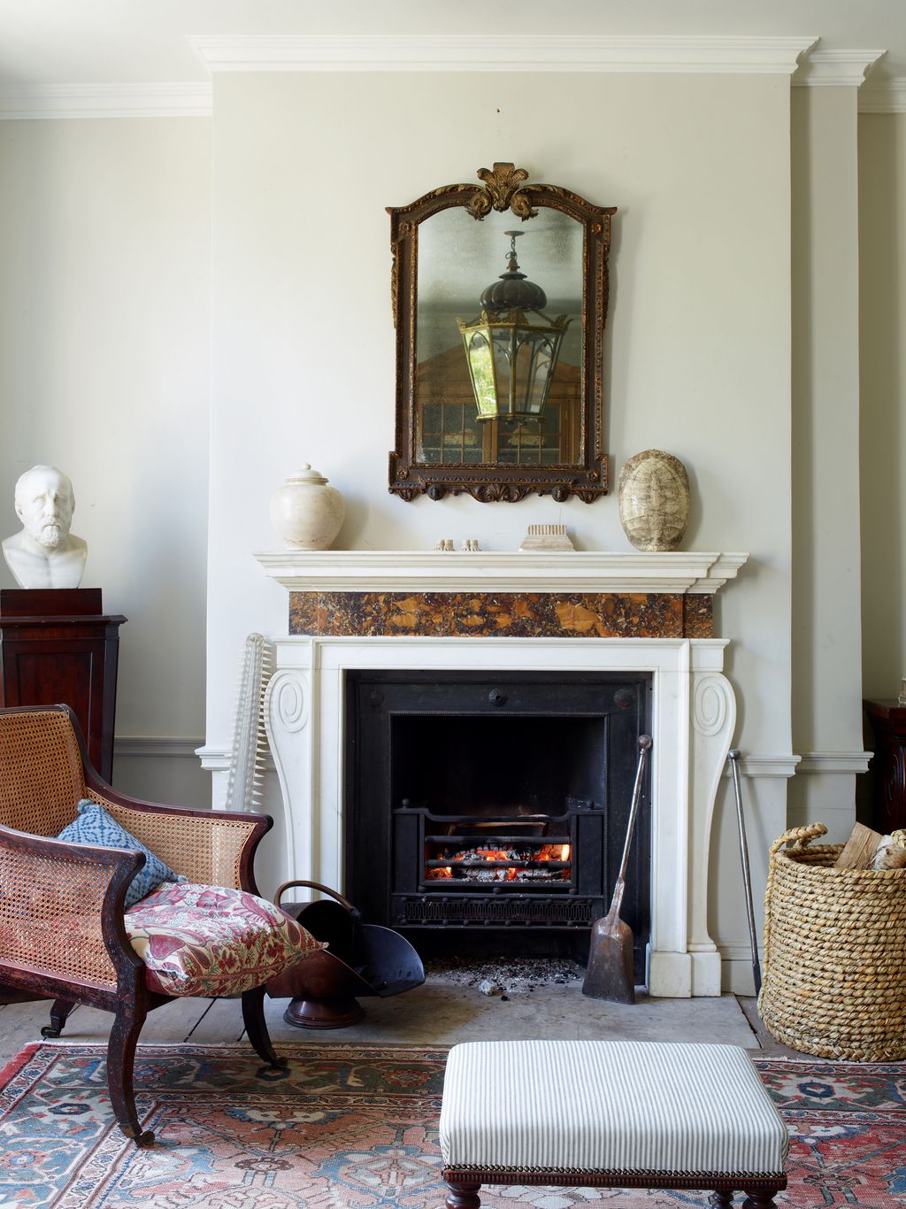 Image may contain Fireplace Indoors Furniture Hearth Living Room Room and Interior Design