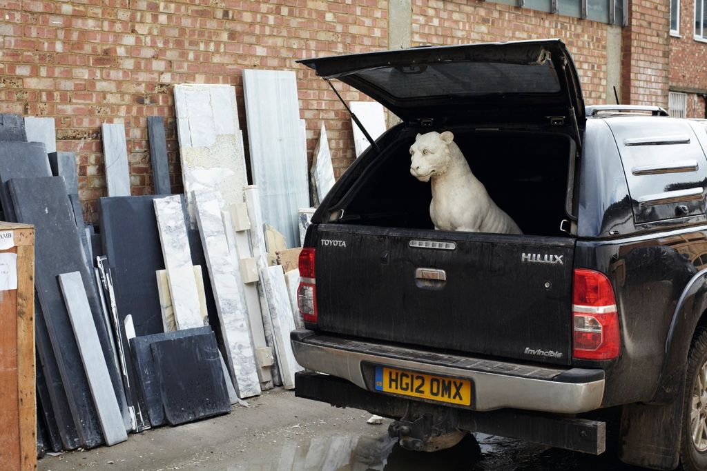 A Coadestone lion by Stephen Pettifer awaits delivery outside the Jamb workshop in Wandsworth.