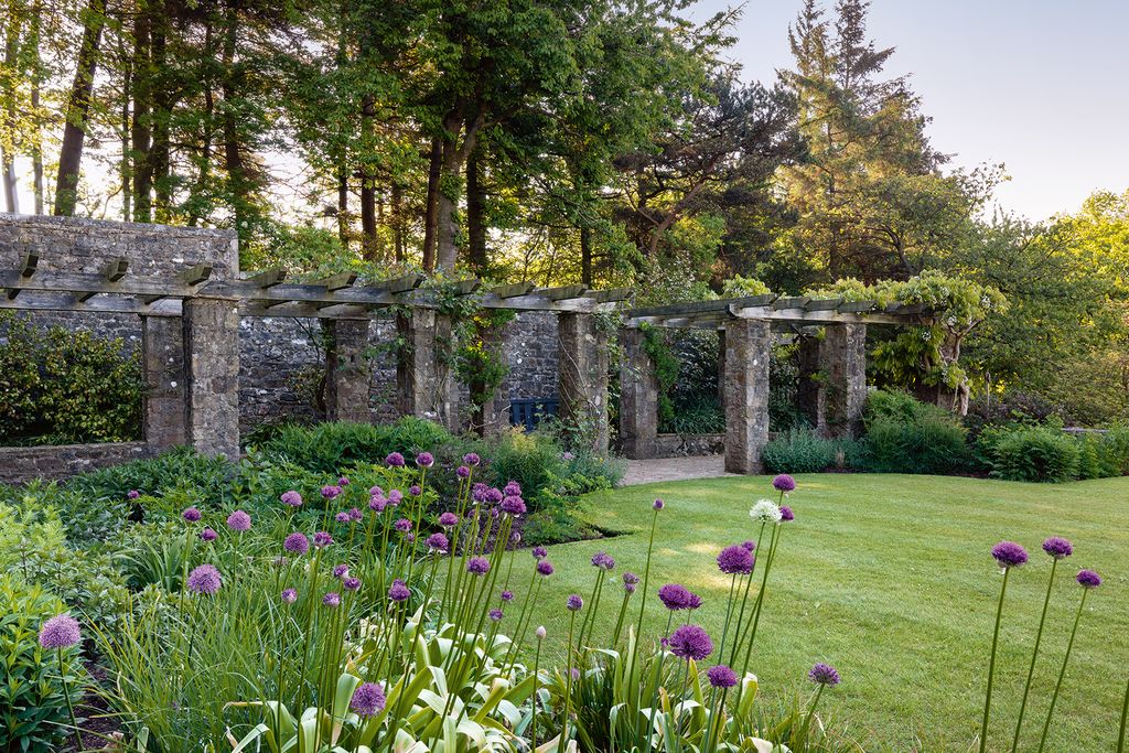 Image may contain Outdoors Plant Garden Arbour Patio Grass and Porch